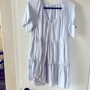 Madewell baby doll light blue dress with pockets and ties on bottom tier. Sz L.